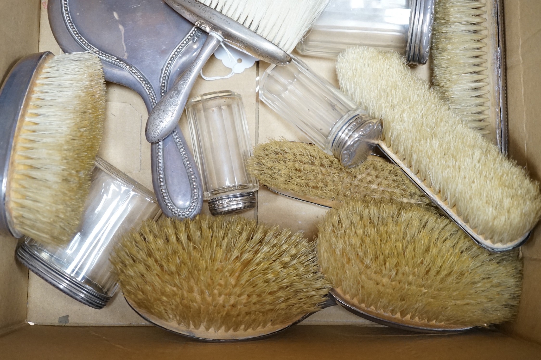 A quantity of assorted silver mounted hand mirrors, brushes and toilet jars, various dates and makers